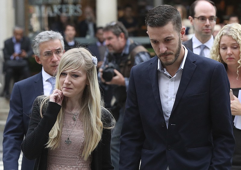 The parents of the critically ill infant Charlie Gard, Chris Gard and Connie Yates, arrive at the Royal Courts of Justice in London ahead of the latest High Court hearing in London Monday July 24, 2017 . They returned to the court for the latest stage in their effort to seek permission to take the child to the United States for medical treatment. Britain's High Court is considering new evidence in the case of Charlie Gard. The 11-month-old has a rare genetic condition, and his parents want to take him to America to receive an experimental treatment. (Jonathan Brady/PA via AP)
