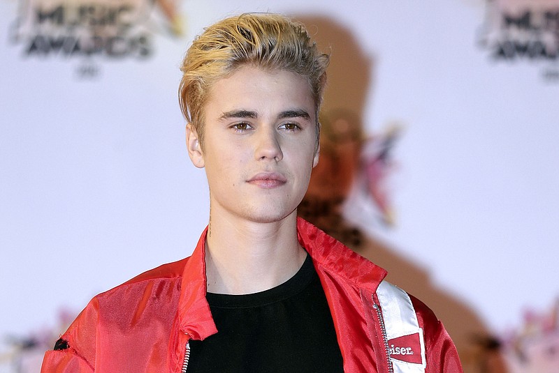 
              FILE - In this Nov. 7, 2015 file photo, Justin Bieber arrives at the Cannes festival palace in Cannes, southeastern France. Bieber is canceling the rest of his Purpose World Tour “due to unforeseen circumstances.” In a statement released Monday, July 24, 2017, his representatives didn’t offer details about the cancellation but said the singer “loves his fans and hates to disappoint them.” He has been on the tour for the last 18 months, playing more than 150 shows in six continents.  (AP Photo/Lionel Cironneau, File)
            