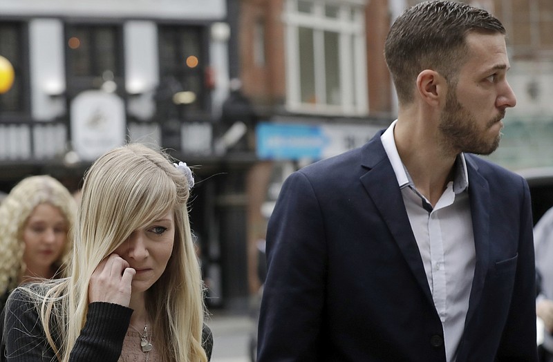 
              The parents of critically ill baby Charlie Gard, Connie Yates and Chris Gard, arrive at the High Court in London, Monday, July 24, 2017. The parents of the 11-month old, who has a rare genetic condition and brain damage, are returning to court for the latest stage in their effort to seek permission to take the child to the United States for medical treatment. (AP Photo/Matt Dunham)
            