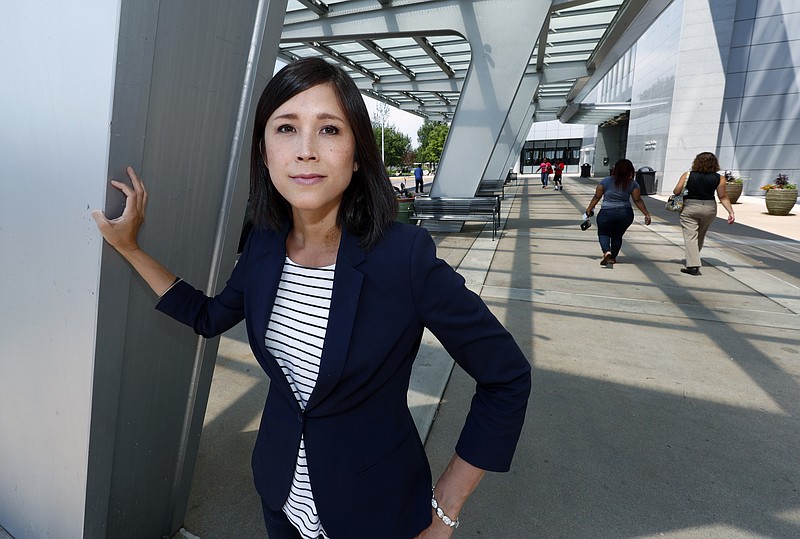 
              Noi Liang, an intersex woman who works part-time as a patient advocate at Children's Hospital Colorado, stands for a photo at the medical center in the Denver suburb of Aurora, Colo., on Friday, July 7, 2017. Liang, who works for a technology firm, says the parents considering surgery for very young intersex children tend to be thorough and thoughtful in their deliberations, hoping that the decisions they make will be the ones that their children _ looking back years from now as adults _ would have wanted them to make. (AP Photo/David Zalubowski)
            