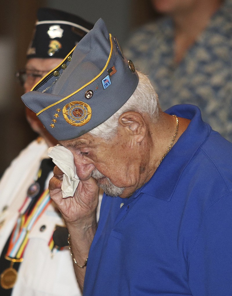 
              World War II veteran Sam Greenberg dabs his eyes during an emotional moment at the Korea War program at the Luzerne County Courthouse.on Saturday, July 22, 2017, in Wilkes Barre Pa. Greenberg's brother Martin, who was a decorated medic during the Korean War, passed away this past February. Greenberg attended in his place. (Dave Scherbenco/The Citizens' Voice via AP)
            