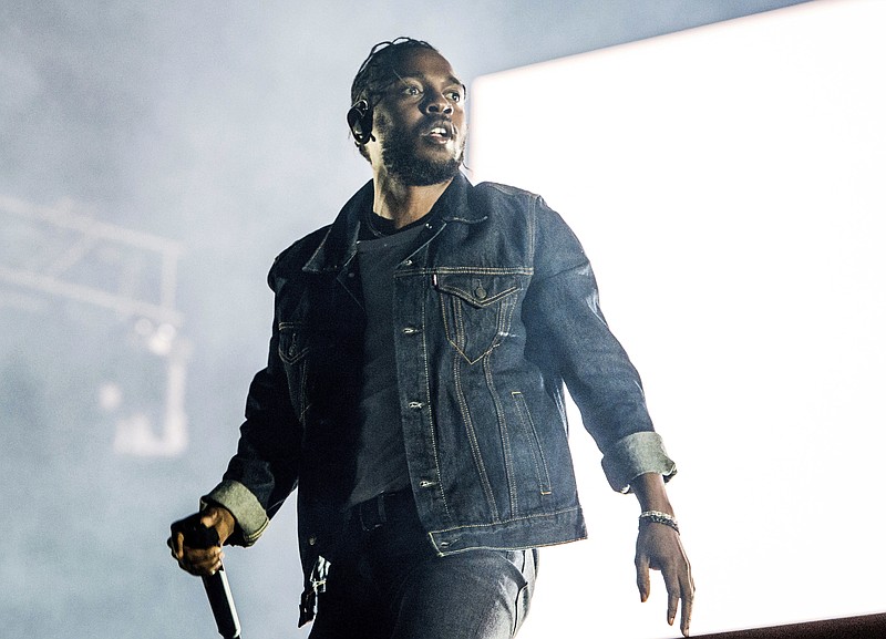
              FILE - In this July 7, 2017 file photo, Kendrick Lamar performs during the Festival d'ete de Quebec in Quebec City, Canada. Lamar is the leader of the MTV Video Music Awards with eight nominations. The 2017 VMAs will air live Aug. 27 from the Forum in Inglewood, Calif. (Photo by Amy Harris/Invision/AP, File)
            