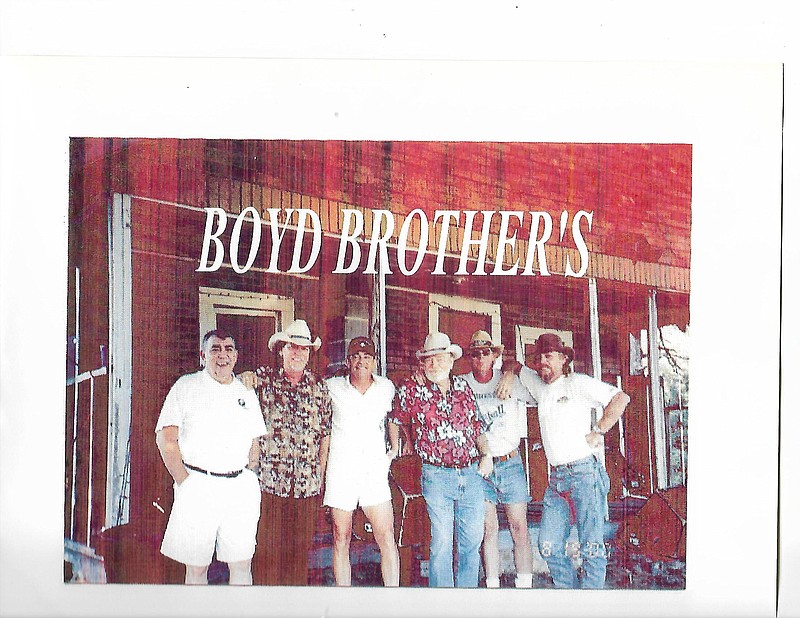 The Boyd brothers are shown at a birthday party for oldest brother Jimmy. They are Gene, Bobby, Billy, Jimmy, Terry "Jug" and Eddie Boyd. Sister Lana (Boyd) Barker also performed in her own band, an all-female band.