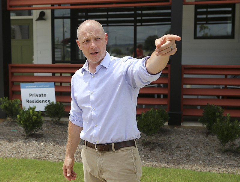 Ethan Collier gives a tour of the new housing development One Hundred at South Broad on Wednesday, July 12, in Chattanooga, Tenn.