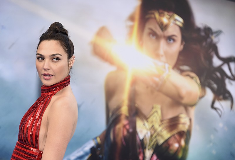 
              FILE - In this May 25, 2017 file photo, Gal Gadot arrives at the world premiere of "Wonder Woman" in Los Angeles. Wonder Woman 2” is set to storm theaters on December 13, 2019. Warner Bros. announced the date late Tuesday, July 25. “Wonder Woman” star Gadot is set to reprise her role as Diana of Themyscira, but a director has yet to be set. Patty Jenkins is still in negotiations for the job. (Photo by Jordan Strauss/Invision/AP, File)
            