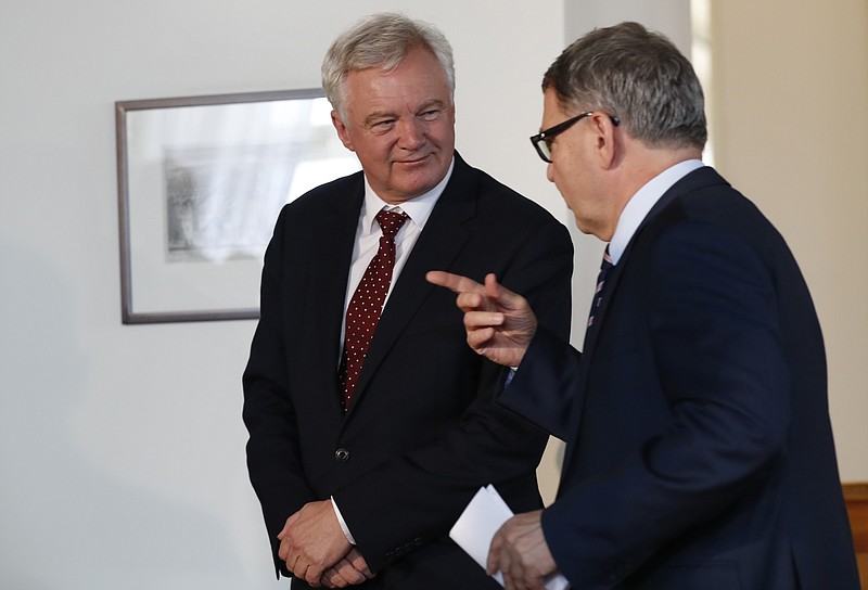 
              Czech Republic's Foreign Minister Lubomir Zaoralek, right, talks to British Secretary of State for Exiting the EU David Davis, left, after their press conference in Prague, Czech Republic, Tuesday, July 25, 2017. (AP Photo/Petr David Josek)
            