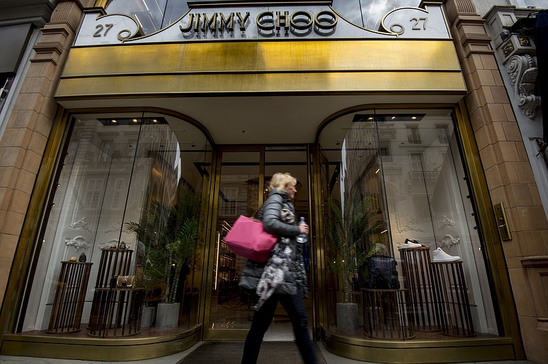 
              FILE - This is a  April 24, 2017 file photo of  the Jimmy Choo shop on New Bond Street, London. American fashion brand Michael Kors has bought luxury shoemaker Jimmy Choo in a deal worth $1.35 billion (896 million pounds.) Kors said Tuesday July 25, 2017  the London-listed Jimmy Choo is "the ideal partner" that will be bolstered with further development of its online presence.  (Lauren Hurley/PA, File via AP)
            