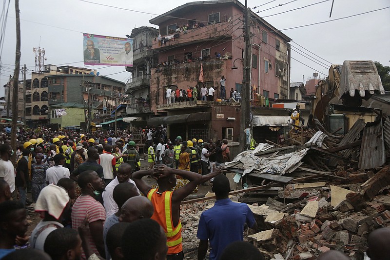 
              Rescue workers search for survivors at the rubbles of a collapsed building in a densely populated neighborhood in Lagos, Nigeria. Tuesday, July 25, 2017. Rescue work is still ongoing. (AP Photo/Sunday Alamba)
            