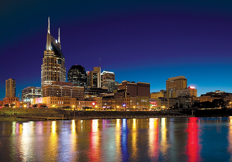 Nashville, Tennessee city skyline at dusk with reflection