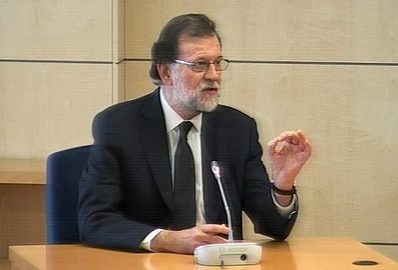 
              In this still made from video, Spain's Prime Minister Mariano Rajoy testifies at Spain's National Court in San Fernando de Henares, outside Madrid, Wednesday, July 26, 2017. Rajoy said Wednesday appearing as a witness before Spain’s National Court that he didn’t know anything about the accounting in the ruling Popular Party when a kickbacks-for-contracts scheme allegedly helped its funding. (EFE TV, POOL vi AP)
            