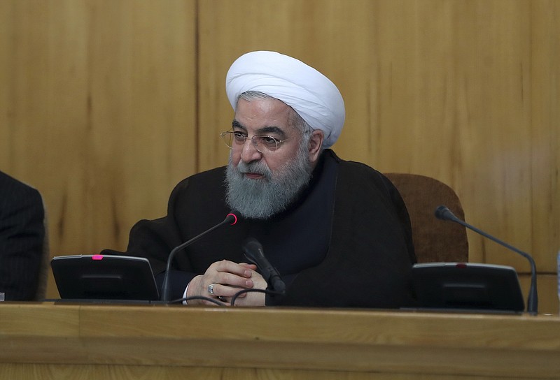 
              In this photo released by official website of the office of the Iranian Presidency, Iran's President Hassan Rouhani speaks in a cabinet meeting in Tehran, Iran, Wednesday, July 26, 2017. Iran's President Hassan Rouhani says his country will respond if U.S. legislation imposing sanctions on people involved in Iran's ballistic missile program becomes law. (Iranian Presidency Office via AP)
            