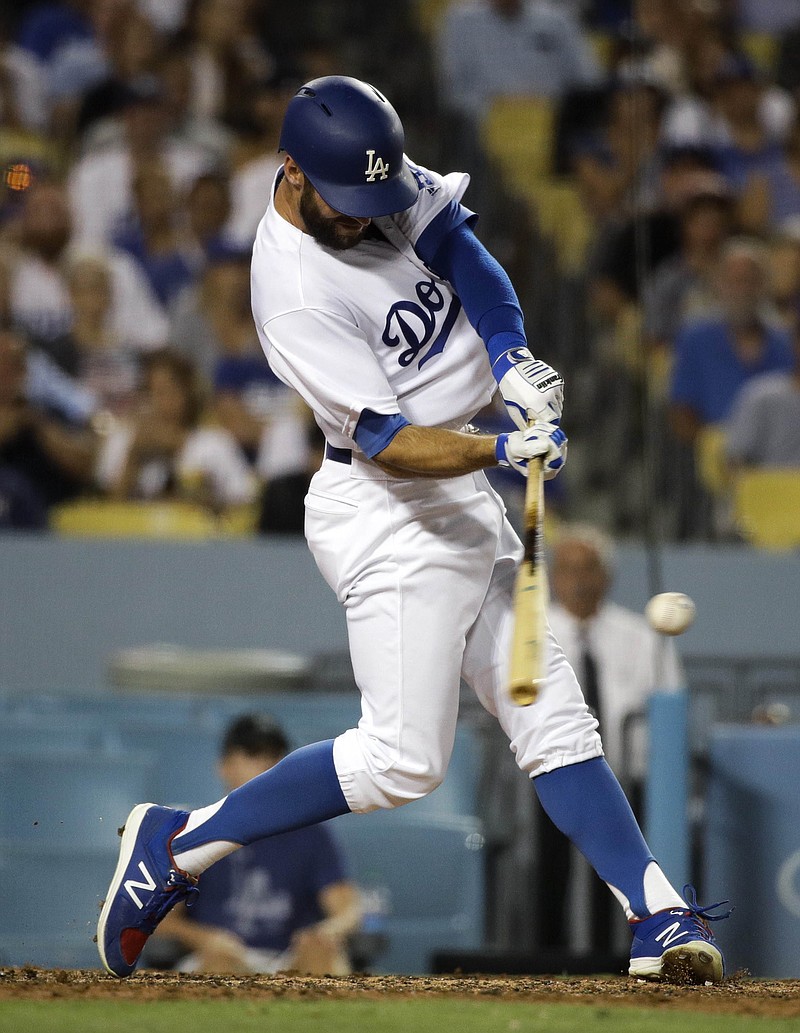 
              Los Angeles Dodgers' Chris Taylor hits a two-run double during the fourth inning of a baseball game against the Minnesota Twins, Tuesday, July 25, 2017, in Los Angeles. (AP Photo/Jae C. Hong)
            