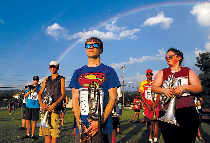 Senior Tyson Steffenhagen, right, stands with the brass section during marching band practice at Ooltewah High School.