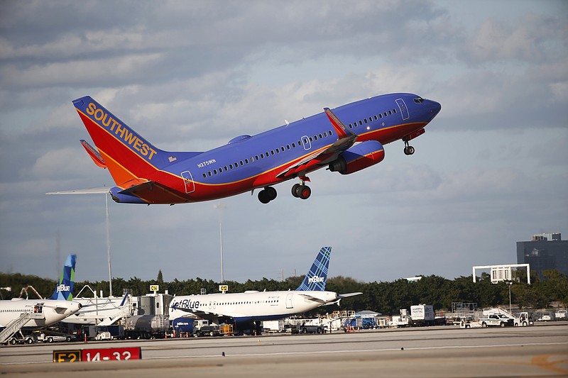 
              FILE - In this Friday, Feb. 10, 2017, file photo, a Southwest Airlines plane takes off from Palm Beach International Airport in West Palm Beach, Fla. Southwest Airlines Co. reports earnings, Thursday, July 27, 2017. (AP Photo/Wilfredo Lee, File)
            