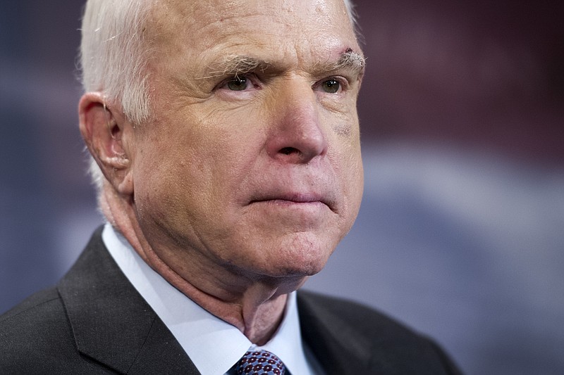 
              Sen. John McCain, R-Ariz., speaks to reporters on Capitol Hill in Washington, Thursday, July 27, 2017. The Senate voted decisively to approve a new package of stiff financial sanctions against Russia, Iran and North Korea, sending the popular bill to President Donald Trump for his signature after weeks of intense negotiations. The legislation is aimed at punishing Moscow for meddling in the 2016 presidential election and its military aggression in Ukraine and Syria, where the Kremlin has backed President Bashar Assad. McCain said the bill’s passage was long overdue, a jab at Trump and the GOP-controlled Congress. McCain, chairman of the Armed Services Committee, has called Putin a murderer and a thug.(AP Photo/Cliff Owen)
            