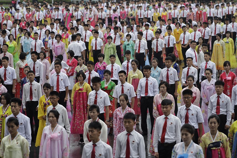 
              North Korean university students wait for the start of a mass dance on Thursday, July 27, 2017, in Pyongyang, North Korea as part of celebrations for the 64th anniversary of the armistice that ended the Korean War. (AP Photo/Wong Maye-E)
            