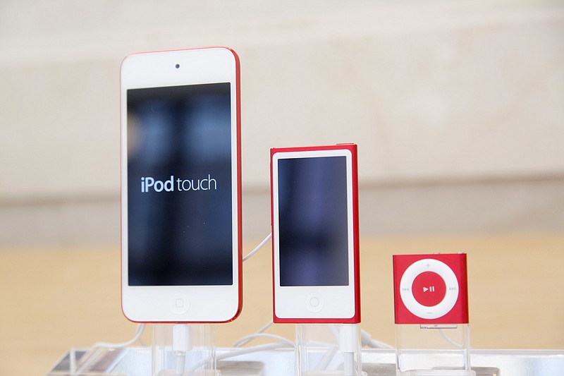 
              FILE- In this June 11, 2015, file photo, from left, an iPod, iPod Nano and iPod Shuffle are displayed at an Apple store in New York. The company discontinued sales of the iPod Nano and iPod Shuffle on Thursday, July 27, 2017, in a move reflecting the waning popularity of the devices in an era when most people store or stream their tunes on smartphones. (AP Photo/Mark Lennihan, File)
            