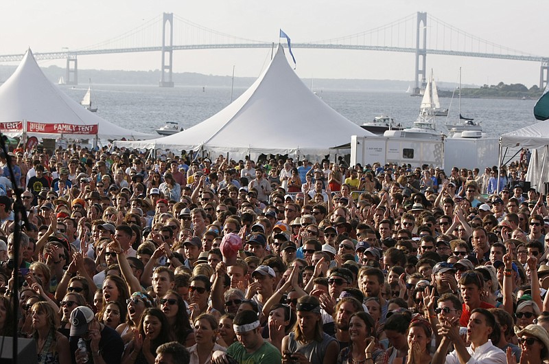 
              FILE- In this July 27, 2013, file photo, people listen as the Avett Brothers perform at the 54th edition of the Newport Folk Festival in Newport, R.I. Thousands of music lovers are expected to descend on the city by the sea for this year’s festival at Fort Adams, which sold out before any acts were announced. Acts including Fleet Foxes and Regina Spektor are among the artists performing Friday, July 27, 2017. It is the 58th anniversary of the festival’s founding in 1959. (AP Photo/Joe Giblin, File)
            