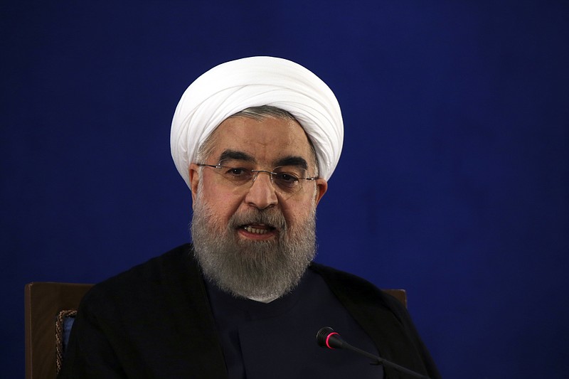 
              FILE - In this May 22, 2017, file photo, Iranian President Hassan Rouhani speaks at a news conference in Tehran, Iran. The Trump administration is pushing for inspections of suspicious Iranian military sites in a bid to test the strength of the nuclear deal that President Donald Trump desperately wants to cancel, senior U.S. officials said. The inspections are one element of what is designed to be a more aggressive approach to preventing Iran from obtaining a nuclear weapon. (AP Photo/Vahid Salemi, File)
            