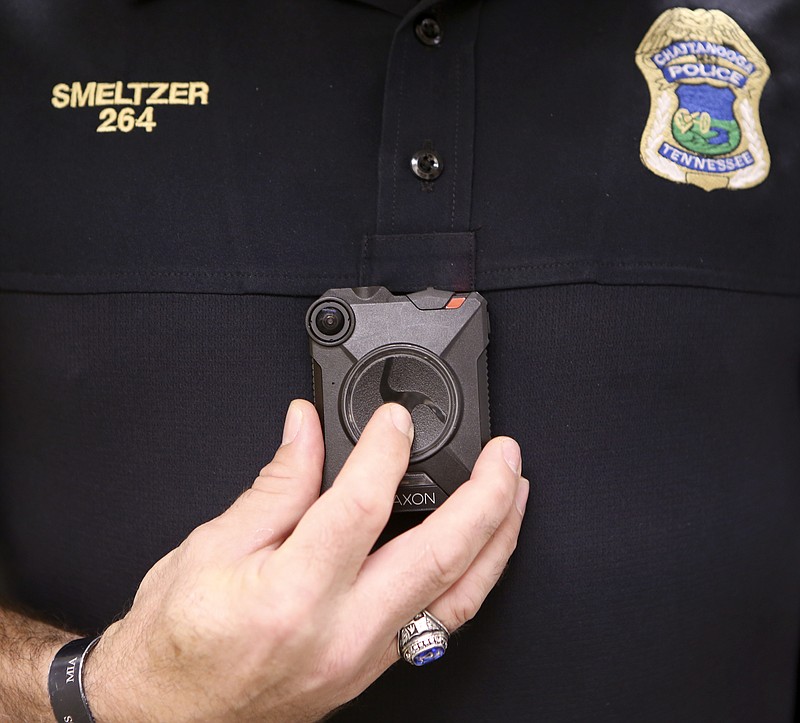 Chattanooga Police Lt. Mark Smeltzer demonstrates where the body camera is worn at the Police Services Center on Tuesday, July 25, in Chattanooga, Tenn.