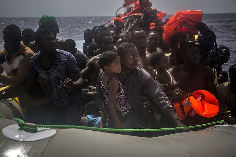 
              Migrants wait to be rescued by aid workers of Spanish NGO Proactiva Open Arms in the Mediterranean Sea, about 15 miles north of Sabratha, Libya on Tuesday, July 25, 2017. (AP Photo/Santi Palacios)
            