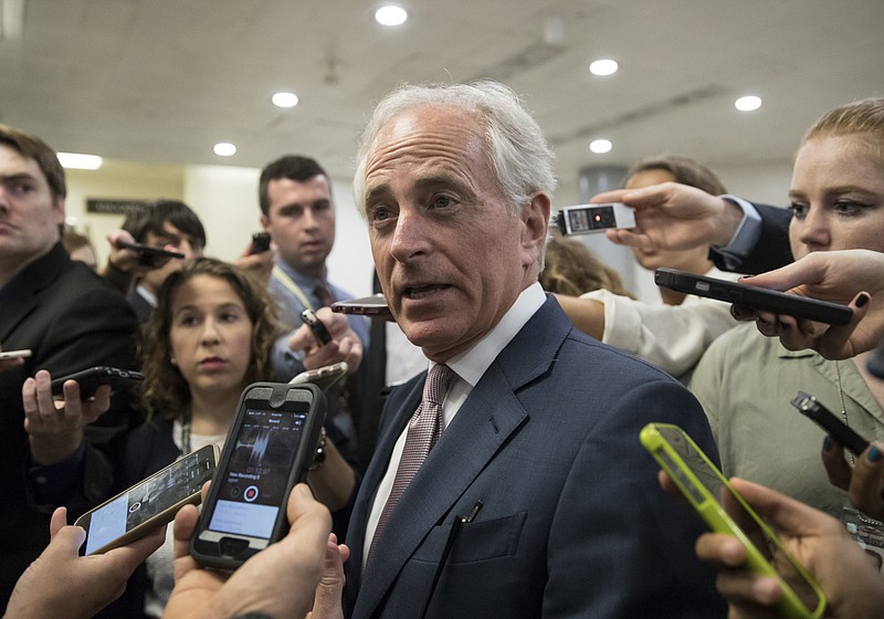 Sen. Bob Corker, R-Tenn. is surrounded by reporters on Capitol Hill in Washington, Thursday, July 27, 2017, as the Republican majority in Congress remains stymied by their inability to fulfill their political promise to repeal and replace "Obamacare." (AP Photo/J. Scott Applewhite)