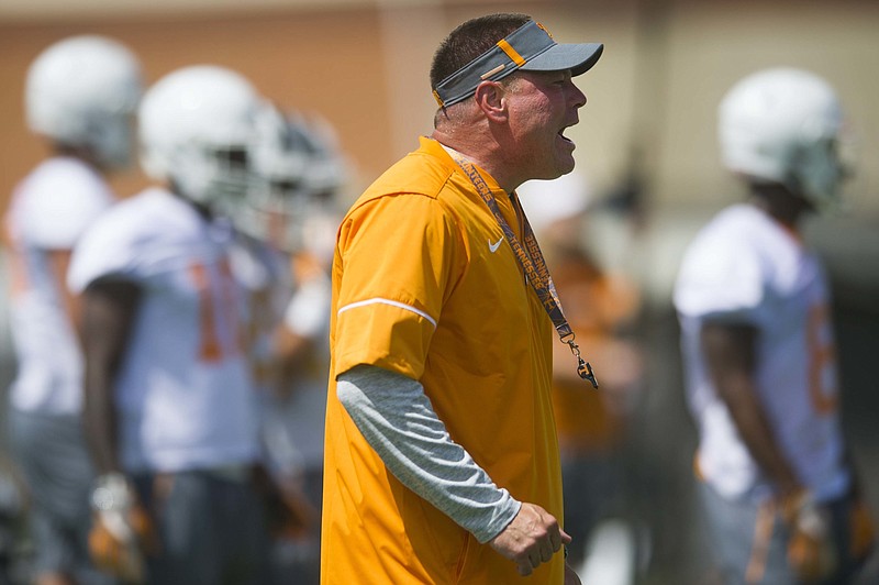 Head coach Butch Jones yells on the field during NCAA college football practice at Anderson Training Facility in Knoxville, Tenn., Saturday, July 29, 2017, in Knoxville, Tenn. (Catie McMekin/Knoxville News Sentinel via AP)