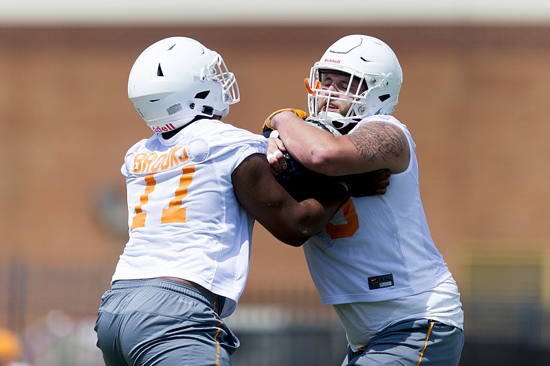 Tennessee defensive lineman Devonte Brooks and offensive lineman Coleman Thomas drill together during NCAA college football practice at Anderson Training Facility in Knoxville, Tenn., on Saturday, July 29, 2017. (Calvin Mattheis/Knoxville News Sentinel via AP)