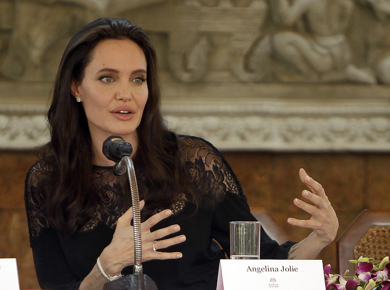 
              FILE - In a Feb. 18, 2017 file photo, actress Angelina Jolie gives a press conference in Siem Reap province, Cambodia.  Jolie says the account of her casting process for children for her film Khmer Rouge film “First They Killed My Father” described in a recent Vanity Fair profile is false and upsetting. Jolie and producer Rithy Panh issued joint statements refuting the account Sunday, July 30, through a representative from Netflix, which is producing and distributing the film. (AP Photo/Heng Sinith, File)
            