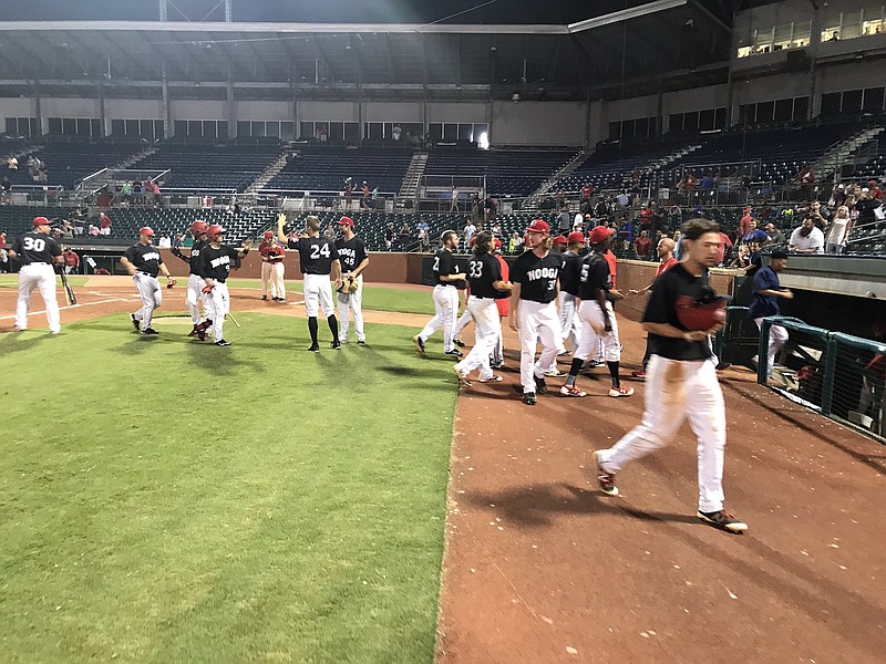 Members of the Chattanooga Lookouts celebrate the 2-1 victory over Birmingham at AT&T Field that lasted 21 innings, encompassed five hours and 29 minutes, and ended at 12:45 Sunday morning.