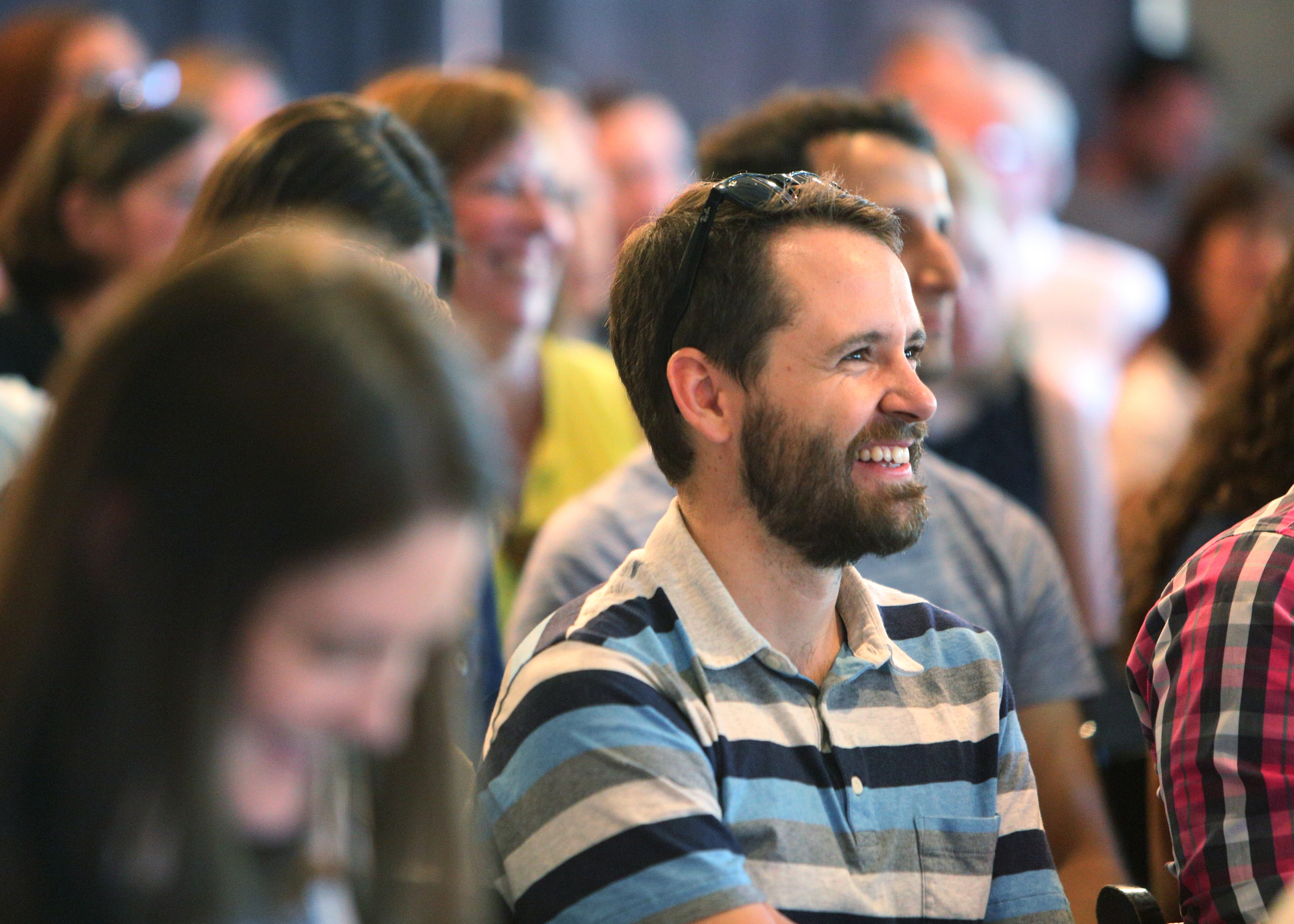 Graham Harrell, the coordinator of learning and development at MediTract, laughs at a presentation Sunday, July 30, 2017, during Pitch Night for the Teacherpreneur Incubator at Granfalloon in Chattanooga, Tenn. The Teacherpreneur Incubator brings together teachers, business people and community members.