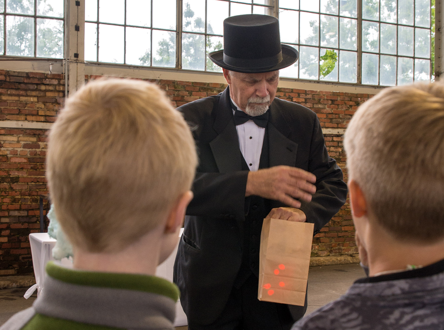 Bill Cox performs magic tricks