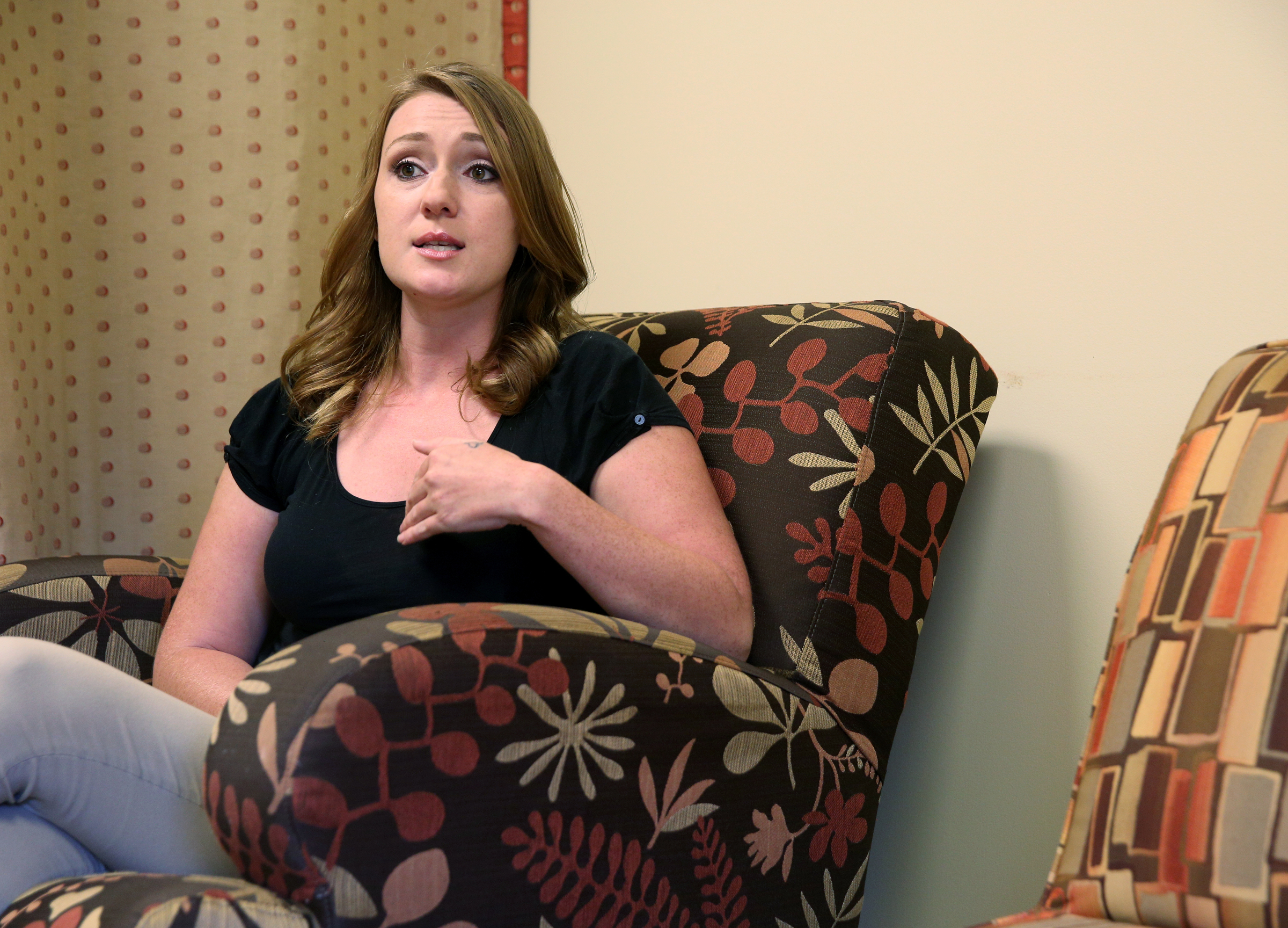 Amanda Smothers talks about getting diapers donated to her for her 2-year-old son through Purposity at Signal Centers Monday, July 31, 2017, in Chattanooga, Tenn. Purposity helps individuals find others in need that they can donate supplies to near the individual's location.