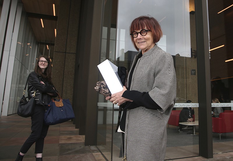 
              Prof. Jenny Hocking arrives at the Federal Court in Sydney, Monday, July 31, 2017. Hocking, a Monash University historian, is asking the court to force the National Archives of Australia to release the letters between the British monarch, who is also Australia's constitutional head of state, and her former Australian representative, Governor-General Sir John Kerr. (AP Photo/Rick Rycroft)
            