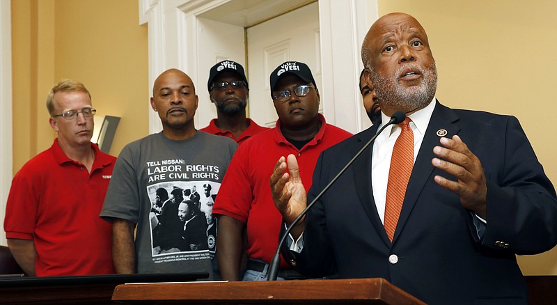 
              U.S. Rep. Bennie Thompson, D-Miss., right, expresses his desire for a company intimidation free union vote at the Nissan vehicle assembly plant in Canton, Miss., during a Jackson, Miss., news conference, Monday, July 31, 2017, where he was joined by local the mayors of Canton and Jackson. Joining Thompson were Nissan employees Travis Parks, left, Lee Ruffin, second from left, Eric Hearn, center and Ernest Whitfield, second from right. The UAW has a vote scheduled Aug. 3-4, on whether it should represent some 3,700 workers. (AP Photo/Rogelio V. Solis)
            