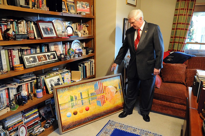 In a Dec. 22, 2011, photograph, U.S. Rep. John J. Duncan Jr. shows off items from his political memorabilia collection in Knoxville, Tenn. The collection was amassed during his 23 years in the U.S. House, and includes items that belonged to his dad, John Duncan Sr., the late Knoxville mayor and congressman. (AP Photo/Adam Brimer, Knoxville News Sentinel)