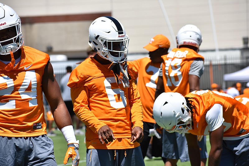 Graduate transfer cornerback Shaq Wiggins stretches before Tennessee's practice on July 30.