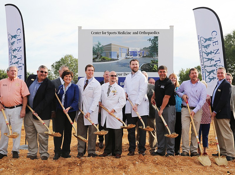 Ringgold City Council, Catoosa County officials and employees of the new Center for Sports Medicine and Orthopedics pose for a photo at the ground breaking event Tuesday, Aug. 1, 2017, for the Center for Sports Medicine and Orthopedics along Battlefield Parkway in Ringgold, Ga. The center specializes in surgeries, non-invasive work and rehab for bones and muscles. 