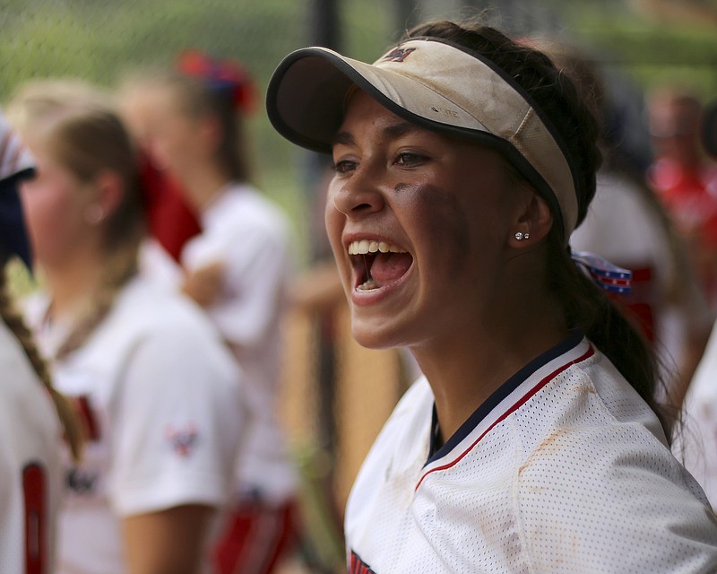 Washington Ladyhawks' Shaunessy Fisk cheers from the dugout during their game against against Tulsa (Okla.) Elite during the Amateur Softball Association's 14-under girls' fastpitch national tournament at The Summit on Tuesday, Aug. 1, in Ooltewah, Tenn.