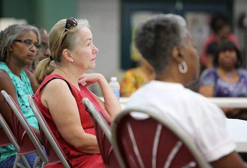 Paulette Skarda listens to other's questions Tuesday, Aug. 1, 2017, at the Eastgate Senior Center in Chattanooga, Tenn. Berke said Tuesday that he will ask the City Council to freeze property taxes for low- and moderate-income seniors to limit the impact of overall property tax increase.