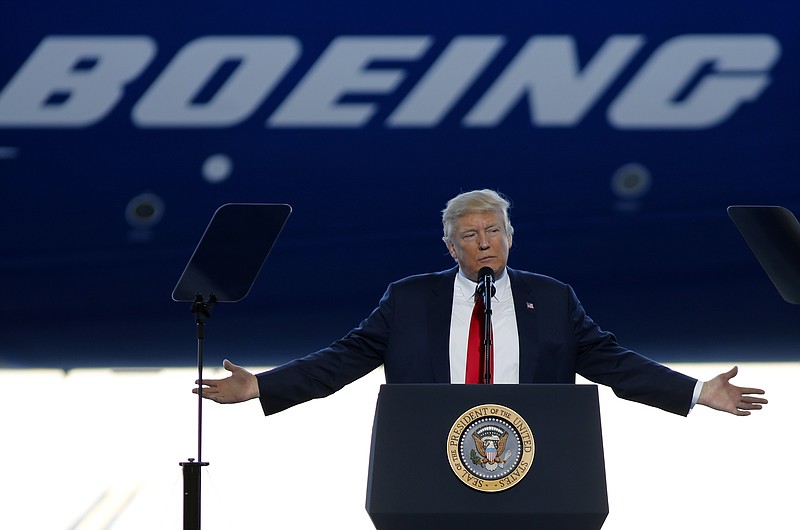 
              FILE- In this Feb. 17, 2017, file photo, President Donald Trump to speaks to Boeing employees in the final assembly building at Boeing South Carolina in North Charleston, S.C. The Air Force, which has been looking for ways to lower the cost of new planes for Air Force One, confirmed on Tuesday, Aug. 1, that it is talking to Boeing about buying two jumbo jets that were ordered but never delivered to a now-defunct Russian airline. (AP Photo/Mic Smith, File)
            