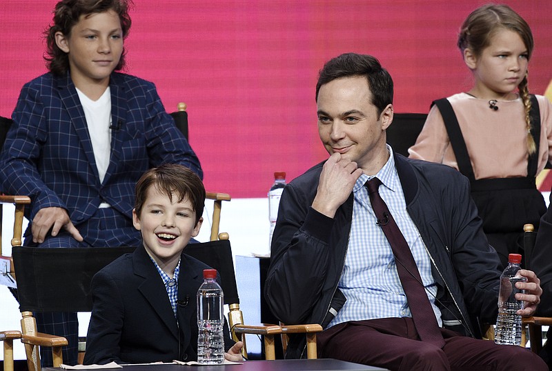 
              Iain Armitage, front left, a cast member in the CBS series "Young Sheldon," answers a question as executive producer/narrator Jim Parsons, front right, looks on during a panel discussion at the 2017 Television Critics Association Summer Press Tour on Tuesday, August 1, 2017, in Beverly Hills, Calif. Looking on in the back are cast members Montana Jordan, left, and Raegan Revord. (Photo by Chris Pizzello/Invision/AP)
            