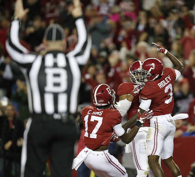 Alabama wide receiver Calvin Ridley, right, celebrates after scoring a touchdown against UTC last November in Tuscaloosa. The Crimson Tide start preseason practices today and open the season Sept. 2 vs. Florida State in Atlanta.