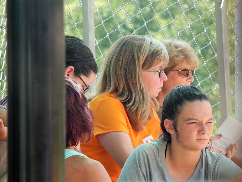 University of Tennessee softball co-head coach Karen Weekly, in orange, watches the ASA 14U national tournament Wednedsay at The Summit of Softball Complex. She's one of many college coaches in the Chattanooga area this week checking out possible recruits in the 2020 and 2021 high school graduating classes.