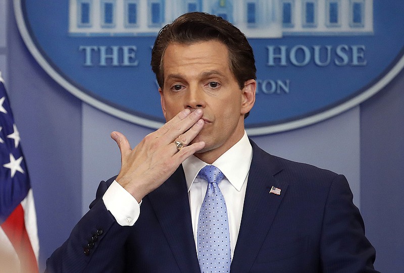 In this July 21, 2017, photo, incoming White House communications director Anthony Scaramucci, right, blowing a kiss after answering questions during the press briefing in the Brady Press Briefing room of the White House in Washington. Scaramucci is out as White House communications director after just 11 days on the job.  A person close to Scaramucci confirmed the staffing change just hours after President Donald Trump's new chief of staff, John Kelly, was sworn into office. (AP Photo/Pablo Martinez Monsivais)
            