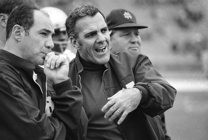 
              FILE - In this Oct. 31, 1970, file photo, Navy head coach Rick Forzano, left, and Notre Dame head coach Ara Parseghian talk on the sideline during a football game in Philadelphia. Notre Dame defeated Navy 56-7. Parseghian died Wednesday, Aug. 2, 2017, at his home in Granger, Ind. he was 94. (AP Photo/File)
            