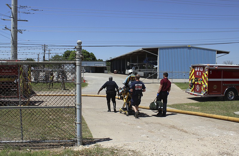 
              In this photo provide by the Bryan, Texas Fire Department, taken April 29, 2014, Bryan Texas firefighters transport injured worker in a stretcher to the ambulance. An explosion at the Bryan Texas Utilities Power Plant left a 60-year-old employee dead and two injured. Earle Robinson, 60, and other employees were doing maintenance work at Bryan Texas Utilities Power Plant, about 100 miles north of Houston, when there was a loud explosion. Workers called 911 and pleaded for help. Older people are dying on the job at a higher rate than workers overall, even as the rate of workplace fatalities decreases, according to an Associated Press analysis of federal statistics. (Bryan, Texas Fire Department via AP)
            