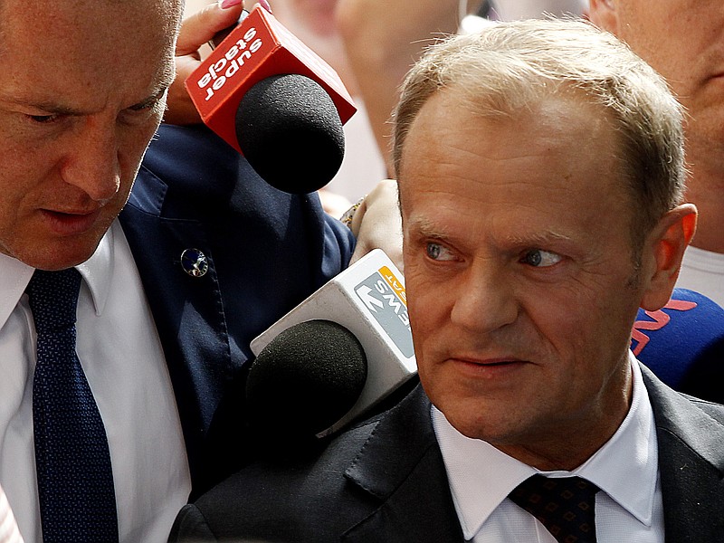 
              Donald Tusk, the president of the European Council, arrives at the national prosecutor's office in his native Poland to be questioned as a witness in an investigation, in Warsaw Thursday Aug. 3, 2017. The investigation focuses on the 2010 plane crash that killed President Lech Kaczynski. Tusk was the Polish prime minister at the time. (AP Photo/Czarek Sokolowski)
            