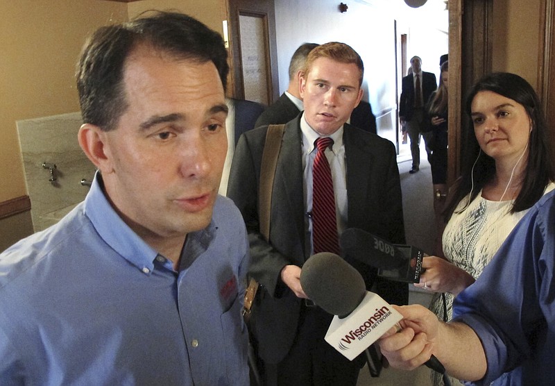 
              Wisconsin Gov. Scott Walker speaks to the media Tuesday, Aug. 1, 2017, in Madison, Wis. Walker said he does not anticipate there will be "major changes" to a bill that would extend $3 billion in taxpayer incentives to lure electronics manufacturer Foxconn to build a factory in the state. (AP Photo/Scott Bauer)
            