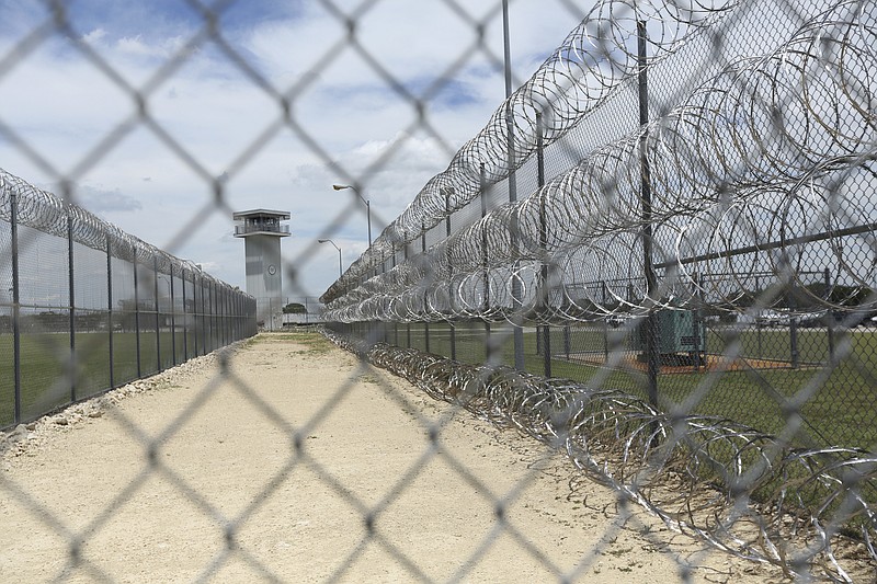 This Wednesday, June 21, 2017 photo shows barbed wire surrounding the prison that holds Jason Robinson, 39, in Gatesville, Texas. Robinson was convicted of murder at 16 and sentenced to automatic life with the possibility of parole. States are responding to U.S. Supreme Court rulings that have found mandatory life-without-parole sentences unconstitutional for juveniles except for the rare homicide offender incapable of rehabilitation. After the latest ruling in January 2016 said those serving such terms must have a chance to argue for release one day, dozens of inmates have won new sentences — and some, freedom — while others wait or fight to have their sentences reviewed. (AP Photo/Jaime Dunaway)